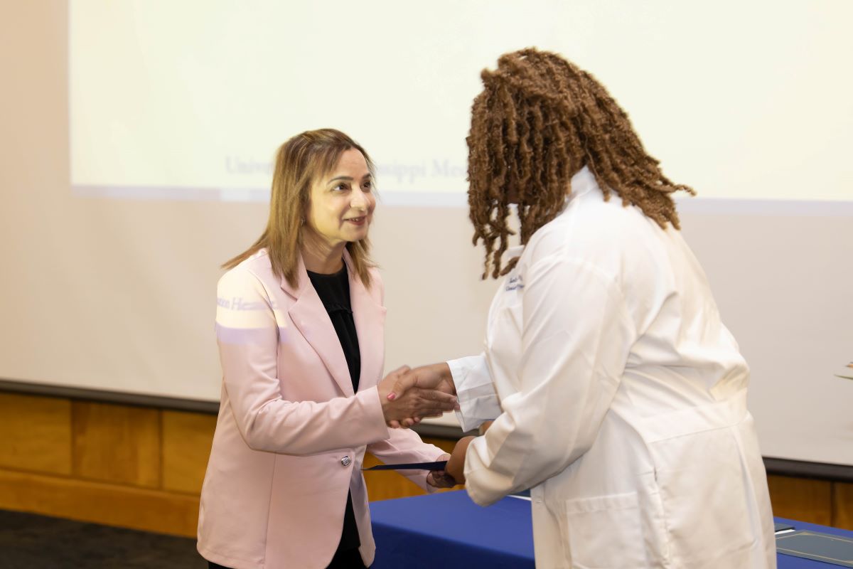 Student accepting an award at the 2023 Honors and Awards Ceremony